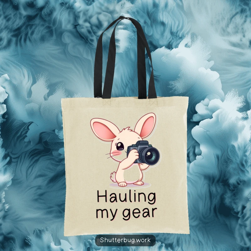 Funny Tote Bag showcasing a rabbit with oversized ears holding a big camera, ideal for carrying photography equipment with a touch of whimsical charm.